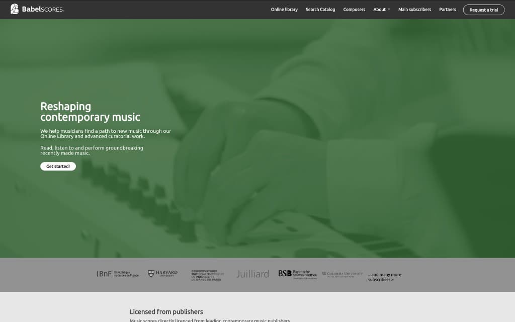Babel Scores homepage showing its navigation and a green-tinted image of hands on a keyboard.